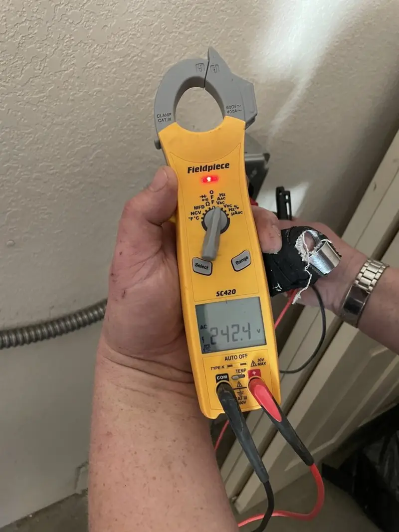 Voltage testing with clamp meter during Whole House Surge Protector in Palestine